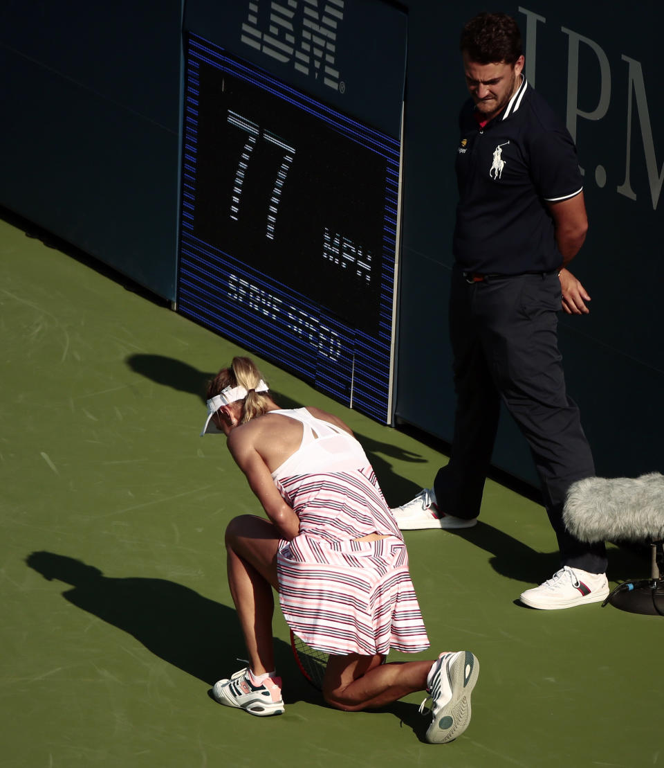 Lesia Tsurenko, of Ukraine, kneels on the court during her match against Marketa Vondrousova, of the Czech Republic, in the fourth round of the U.S. Open tennis tournament, Monday, Sept. 3, 2018, in New York. (AP Photo/Andres Kudacki)