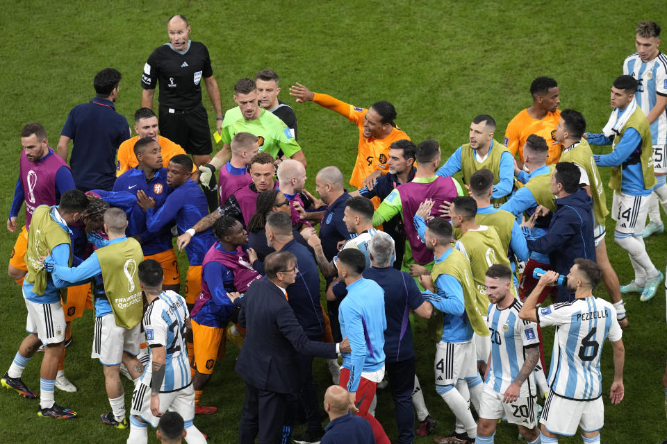 A scuffle breaks out between players during the World Cup quarterfinal soccer match between the Netherlands and Argentina, at the Lusail Stadium in Lusail, Qatar, Friday, Dec. 9, 2022. (AP Photo/Thanassis Stavrakis)