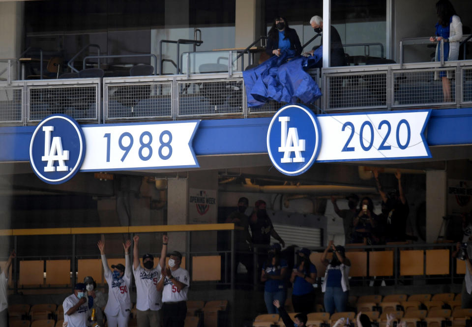 Los Angeles, CA - April 09:  The championship banner is unveiled during the World series ring ceremony prior to a baseball game during Opening Day between the Los Angeles Dodgers and the Washington Nationals in Los Angeles on Friday, April 9, 2021. (Photo by Keith Birmingham/MediaNews Group/Pasadena Star-News via Getty Images)