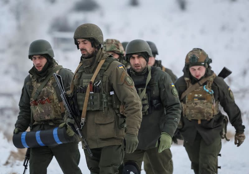 FILE PHOTO: Ukrainian servicemen attend mock anti-sabotage drills near the border with Russia in Sumy region