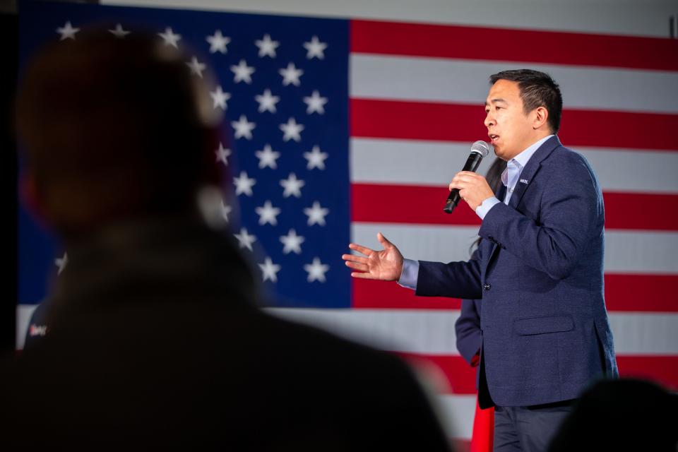 Democratic presidential candidate Andrew Yang addresses supporters in Des Moines after the Iowa caucuses in February. Yang's campaign was anchored to his passion for universal basic income, or UBI, where each American would get $1,000 a month for life. Critics contend the program would cost too much and jeopardize existing welfare programs.