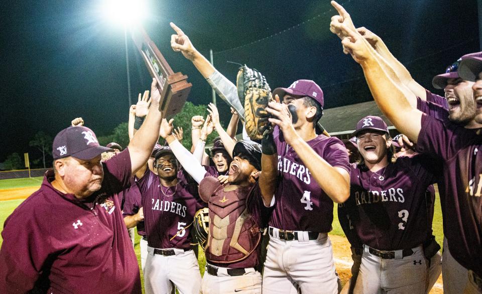Members of the Riverdale High School baseball team celebrate a 6A District 12 championship over Palmetto Ridge on Thursday May 4, 2023.