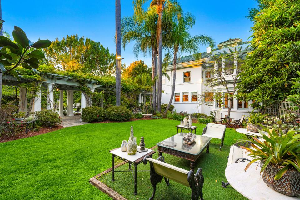 This mansion in a gated part of Fremont Place, within Hancock Park, Los Angeles, used to belong to boxing champion Muhammad Ali. It is up for auction, listed at $13.5 million.