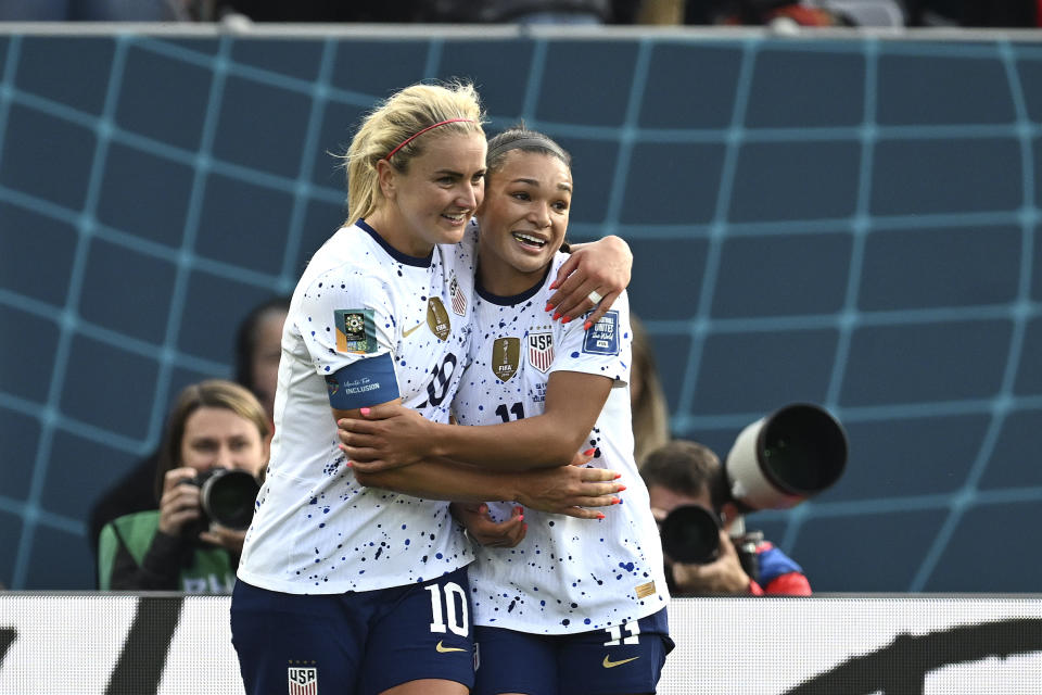 United States' Lindsey Horan, left, celebrates with United States'  Sophia Smith after scoring her team's 3rd goal during the Women's World Cup Group E soccer match between the United States and Vietnam at Eden Park in Auckland, New Zealand, Saturday, July 22, 2023. (AP Photo/Andrew Cornaga)