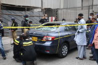 KARACHI, PAKISTAN - JUNE 29: Police officers inspect the site after gunmen attacked the Pakistani stock exchange building in Karachi, Pakistan on June 29, 2020. At least nine people were killed. The dead include four attackers, four Pakistan Stock Exchange security guards and a policeman, Muqaddas Haider, a city police chief, told reporters. At least seven people are also injured. (Photo by Sabir Mazhar/Anadolu Agency via Getty Images)
