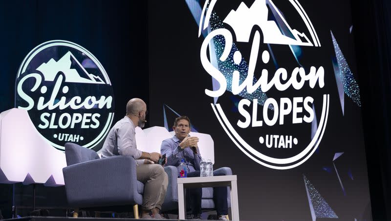 John Bowers, left, director of partnerships at Silicon Slopes, interviews former BYU and NFL quarterback Steve Young, during the Silicon Slopes Summit at Vivint Arena in Salt Lake City on Sept. 30, 2022.