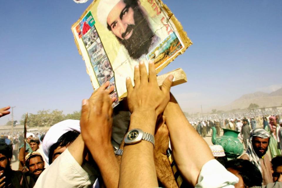 <div class="inline-image__caption"><p>Pro-Taliban supporters hold up a poster of Osama bin Laden during a rally October 1, 2001 in the town of Quetta, Pakistan. </p></div> <div class="inline-image__credit">Paula Bronstein/Getty</div>