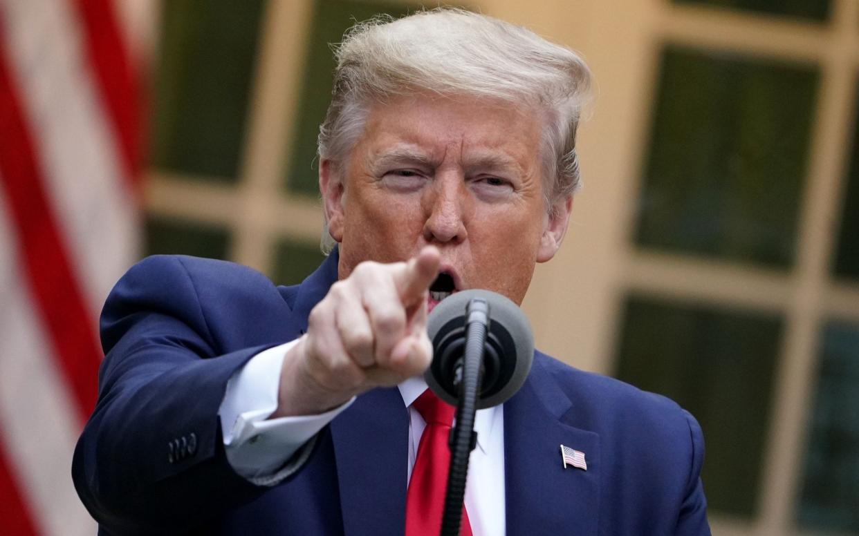 President Trump attacks the WHO during his daily coronavirus briefing, in the Rose Garden of the White House, on April 14  - MANDEL NGAN/AFP