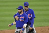 Chicago Cubs' Anthony Rizzo, right, and Jason Kipnis hug after the Cubs defeated the Cleveland Indians 7-2 in a baseball game, Wednesday, Aug. 12, 2020, in Cleveland. (AP Photo/Tony Dejak)