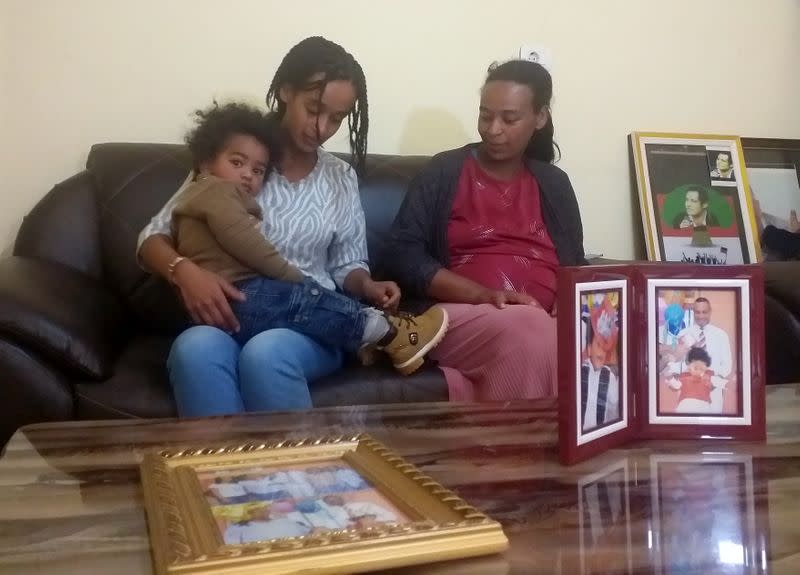 Aselefech Mulatu, wife of Dejene Tafa, a politician who is in custody, and their children are seen during a Reuters interview at their home in Oromiya region's Burayu town northwest of Addis Ababa