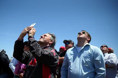 People watch the Ground-based Midcourse Defense (GMD) element of the U.S. ballistic missile defense system launch during a flight test from Vandenberg Air Force Base, California, U.S., May 30, 2017. REUTERS/Lucy Nicholson