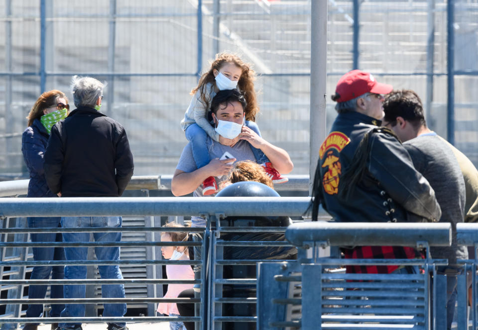 NEW YORK, NEW YORK - APRIL 28: People wear protective face masks in Staten Island during the coronavirus pandemic on April 28, 2020 in New York City. COVID-19 has spread to most countries around the world, claiming over 215,000 lives with over 3.1 million infections reported. (Photo by Noam Galai/Getty Images)