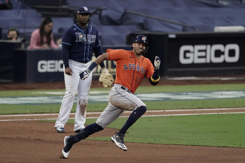 Houston Astros Carlos Correa runs to second after hitting a double against the Tampa Bay Rays during the seventh inning in Game 6 of a baseball American League Championship Series, Friday, Oct. 16, 2020, in San Diego. (AP Photo/Jae C. Hong)