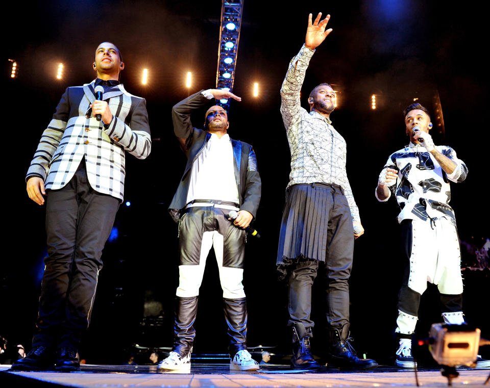 MANCHESTER, ENGLAND - DECEMBER 14:  Marvin Humes, JB Gill, Oritse Williams and Aston Merrygold of JLS perform on stage at Phones 4U Arena as part of the final tour on December 14, 2013 in Manchester, England.  (Photo by Shirlaine Forrest/WireImage)