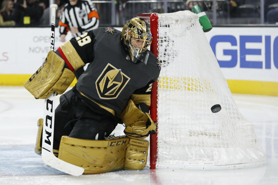 Vegas Golden Knights goaltender Marc-Andre Fleury (29) blocks a shot by the Edmonton Oilers during the third period of an NHL hockey game Wednesday, Feb. 26, 2020, in Las Vegas. (AP Photo/John Locher)