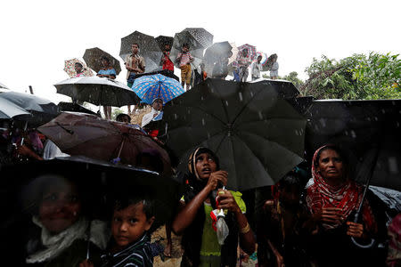 Rohingya refugees wait for aid packages in Cox's Bazar, Bangladesh, September 17, 2017. REUTERS/Cathal McNaughton