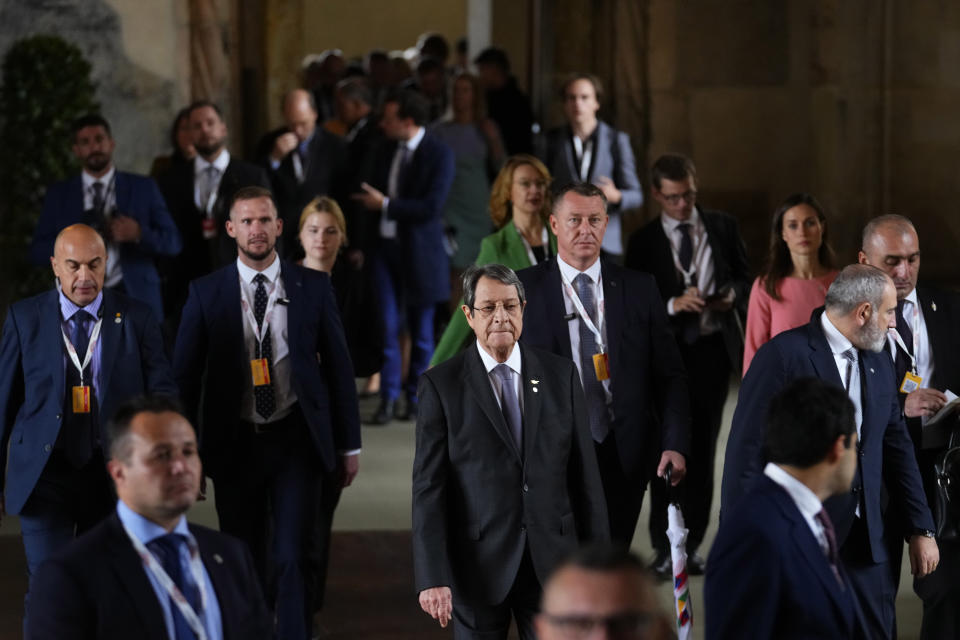 Cypriot President Nicos Anastasiades, center, walks with other leaders after a group photo during meeting of the European Political Community at Prague Castle in Prague, Czech Republic, Thursday, Oct 6, 2022. Leaders from around 44 countries are gathering Thursday to launch a "European Political Community" aimed at boosting security and economic prosperity across the continent, with Russia the one major European power not invited. (AP Photo/Petr David Josek)