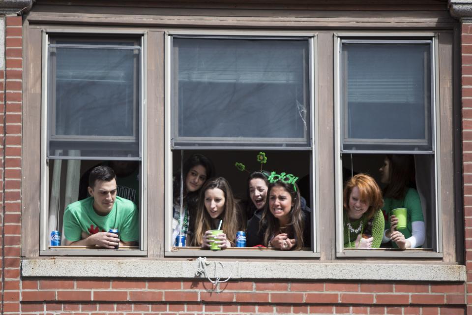 BOSTON, MA - MARCH 20: Paradegoers watch as the annual South Boston St. Patrick's Parade passes on March 20, 2016 in Boston, Massachusetts. According to parade organizers, the South Boston St. Patrick's Parade is listed as the second longest parade in the country. (Photo by Scott Eisen/Getty Images)