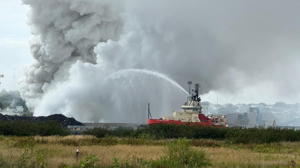 The Atlantic Osprey at work helping to contain the fire at American Iron and Metal. 