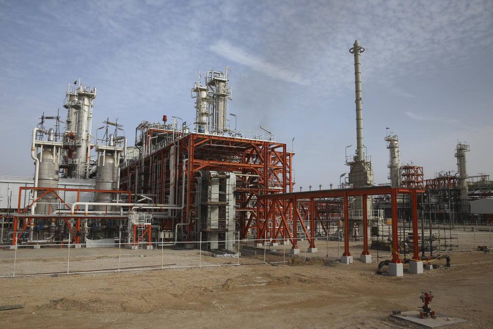 This Saturday, March 16, 2019 photo, shows a natural gas refinery at the South Pars gas field on the northern coast of the Persian Gulf, in Asaluyeh, Iran. Iran's President Hassan Rouhani on Sunday inaugurated a new phase in the development of the South Pars natural gas field. Iran says the development will allow Iran to overtake Qatar in the production of natural gas. The two countries are among the biggest gas producers in the world, and share the South Pars gas field. (AP Photo/Vahid Salemi)
