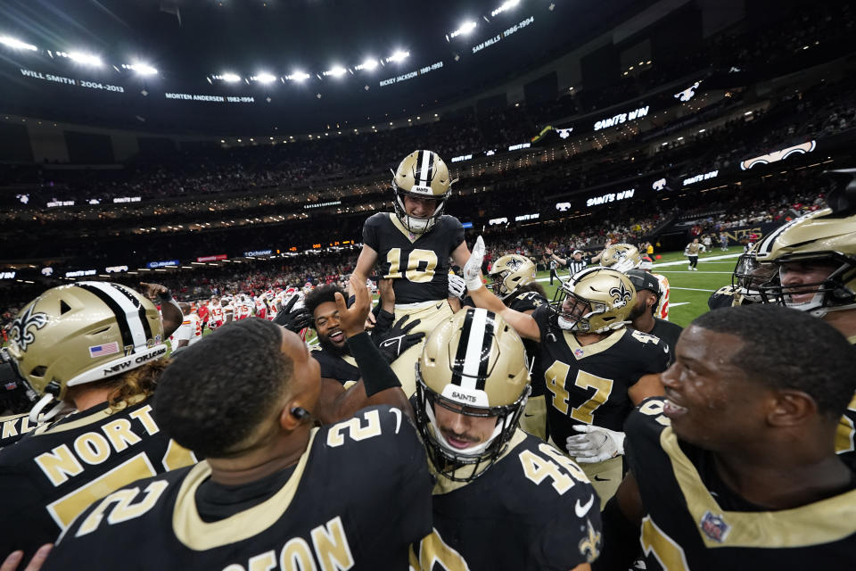 New Orleans Saints place-kicker Blake Grupe (19) celebrates with teammates after kicking a game wining field goal in the second half of a preseason NFL football game against the Kansas City Chiefs in New Orleans, Sunday, Aug. 13, 2023. (AP Photo/Gerald Herbert)