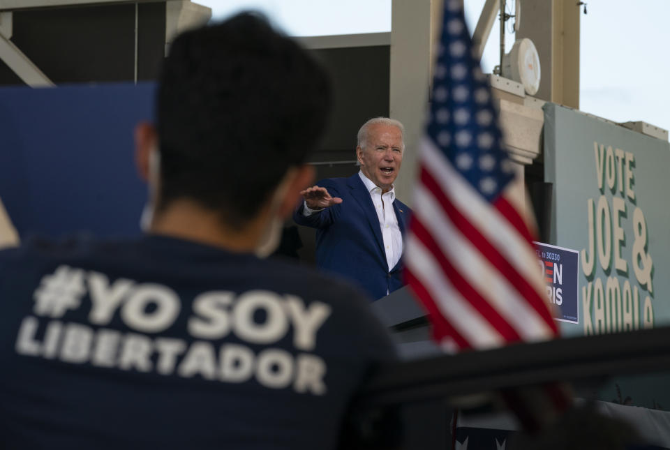 Democratic presidential candidate former Vice President Joe Biden speaks at Miramar Regional Park in Miramar, Fla., Tuesday Oct. 13, 2020, as supporters watch from their cars. (AP Photo/Carolyn Kaster)