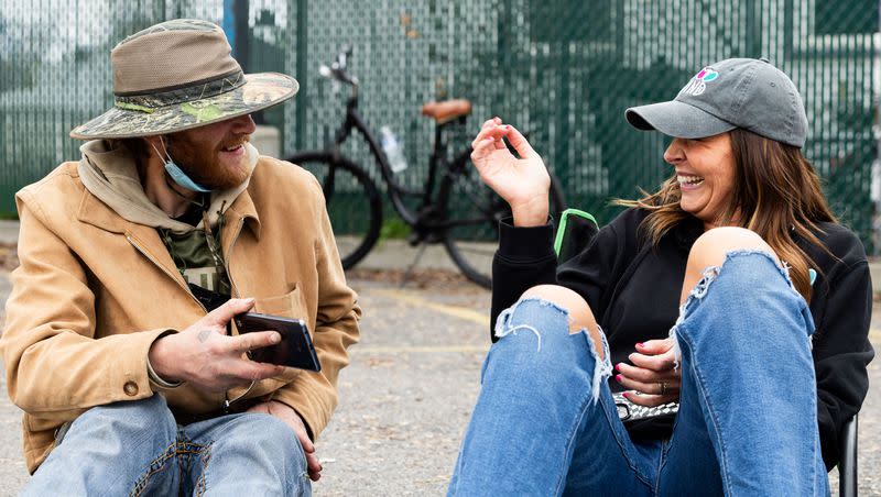 Jessica Lowe, founder of Be a Little Too Kind, laughs with Cameron McCormack, one of her homies, in Salt Lake City on Thursday, Feb. 1, 2024. Be a Little Too Kind is a nonprofit organization focused on assisting homeless people by providing a homemade meal every week and other essential life sustaining items.