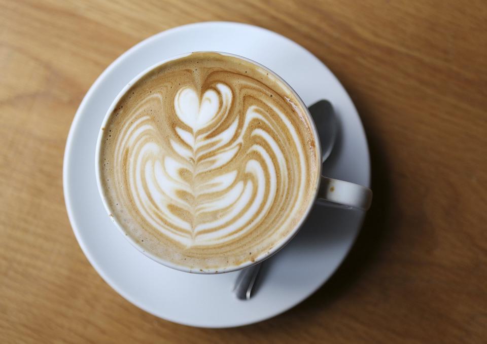 A latte with a rosetta design poured by barista Kahlil Barnett at Fox in the Snow in German Village on Wednesday, September 19, 2018.