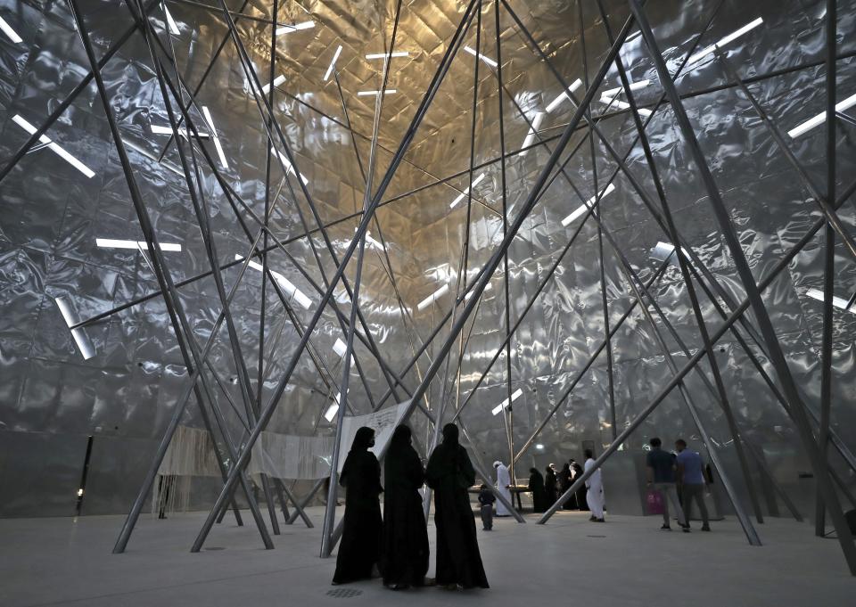 People visit the Bahrain pwldavilion at the Dubai Expo 2020, in Dubai, United Arab Emirates, Sunday, Oct. 3, 2021. (AP Photo/Kamran Jebreili)