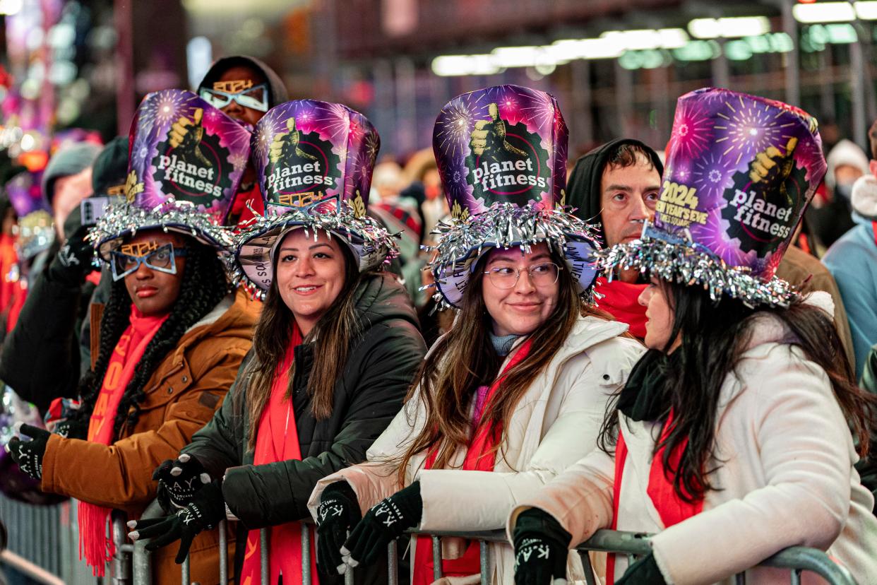 Revelers watch a performance at the New Year's Eve Celebration in Times Square in New York, Sunday, Dec. 31, 2023.