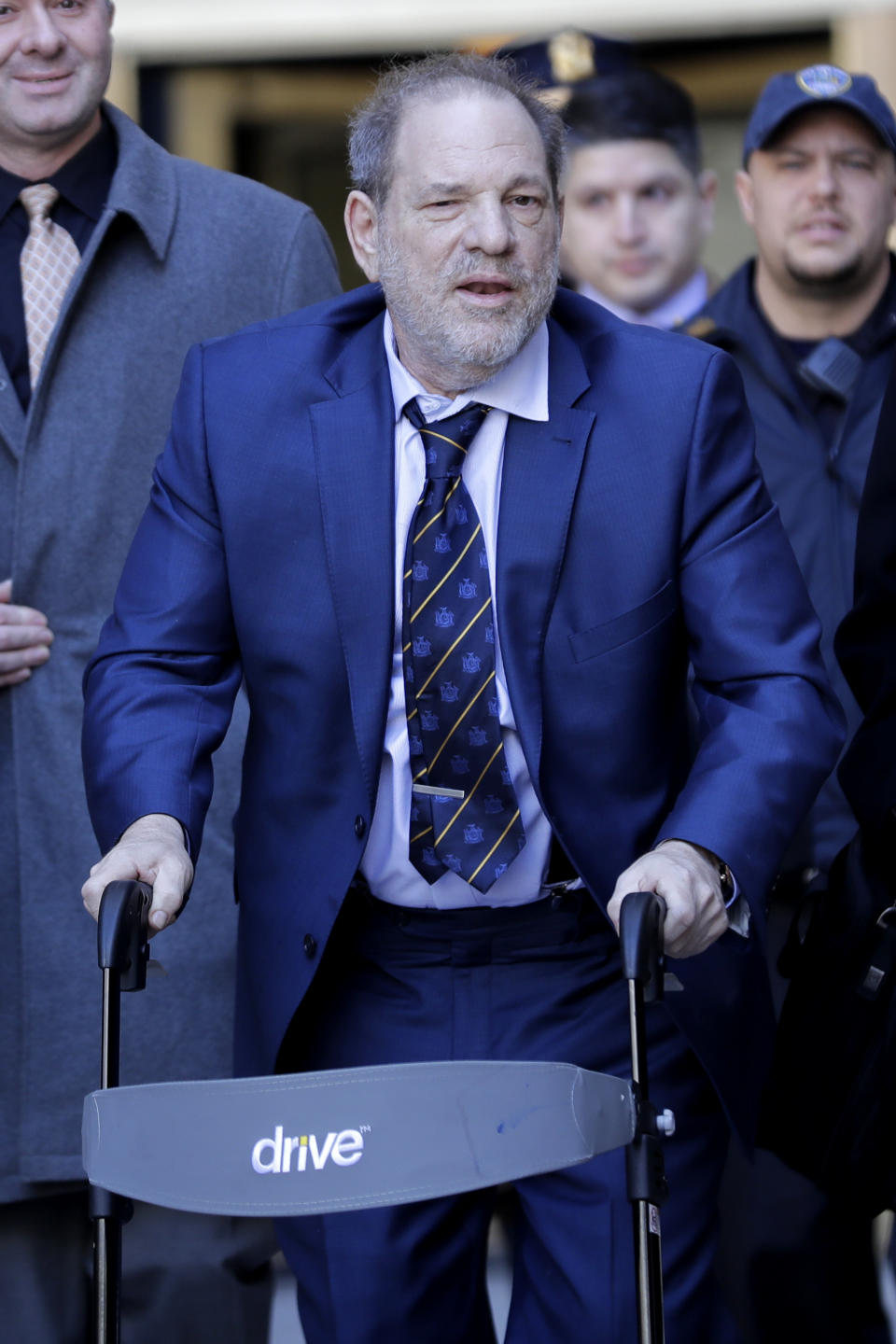 Harvey Weinstein leaves a Manhattan courthouse after closing arguments in his rape trial in New York, Friday, Feb. 14, 2020. (AP Photo/Seth Wenig)