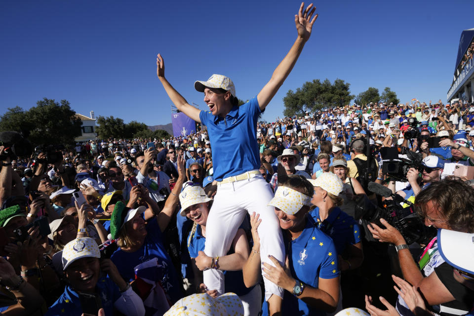 Europe's Carlota Ciganda is carried by members of her team after wining the Solheim Cup golf tournament in Finca Cortesin, near Casares, southern Spain, Sunday, Sept. 24, 2023. Europe has beaten the United States during this biannual women's golf tournament, which played alternately in Europe and the United States. (AP Photo/Bernat Armangue)