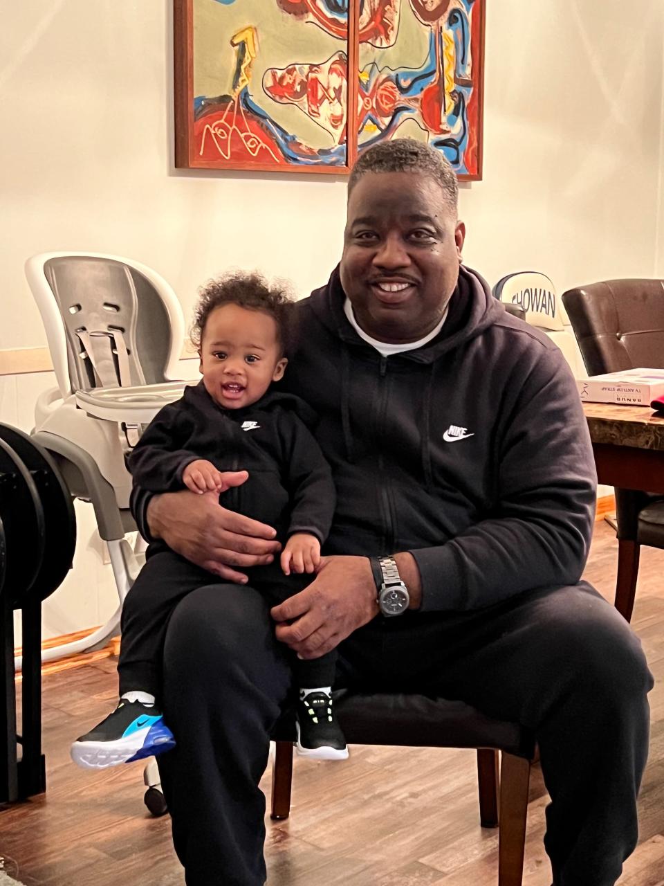 Illya McGee, right, holds his nephew Illya McGee. The younger Illya is the son of Willie McGee, who is a younger brother to the older Illya.