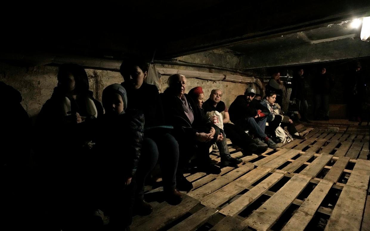 People shelter underground following explosions in Lviv, western Ukraine - AP Photo/Nariman El-Mofty