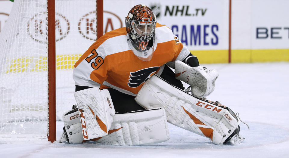 Philadelphia Flyers goalie Carter Hart, without his stick, guards the goal crease during the third period of the team's NHL hockey game against the New Jersey Devils on Wednesday, Oct. 9, 2019, in Philadelphia. The Flyers won 4-0. (AP Photo/Tom Mihalek)