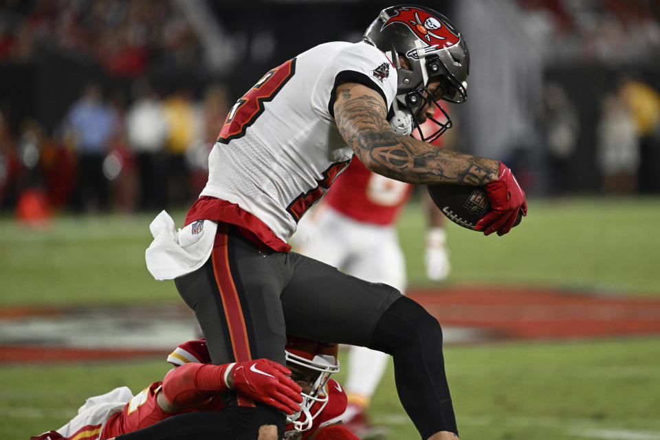 Tampa Bay Buccaneers wide receiver Mike Evans (13) runs the ball during the second half of an NFL football game against the Kansas City Chiefs Sunday, Oct. 2, 2022, in Tampa, Fla. (AP Photo/Jason Behnken)