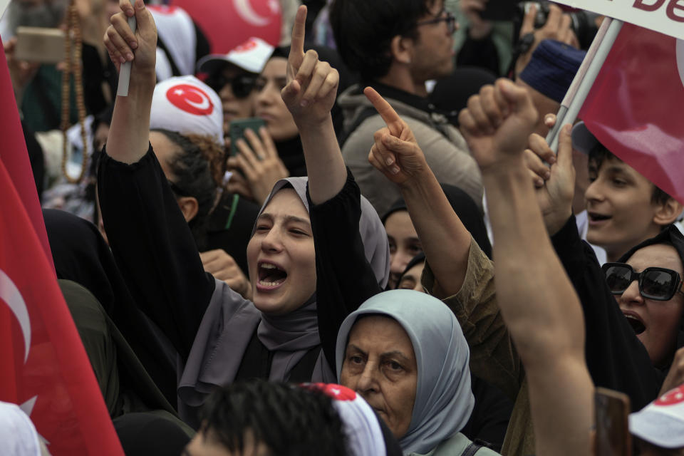 Turkish demonstrators chant slogans while holding Turkish flags during a anti LGBTI+ protest, in Fatih district of Istanbul, Sunday, Sept. 18, 2022. (AP Photo/Khalil Hamra)