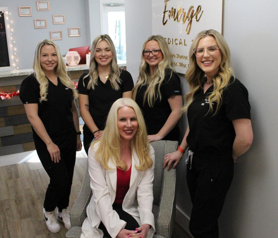 Tamie Starner, certified nurse practitioner and owner of Emerge Medical Spa, seated, is pictured with staff members Tiffany Mowinski, left, Makenzie Ervin, Morgan Craft and Halie Duke.