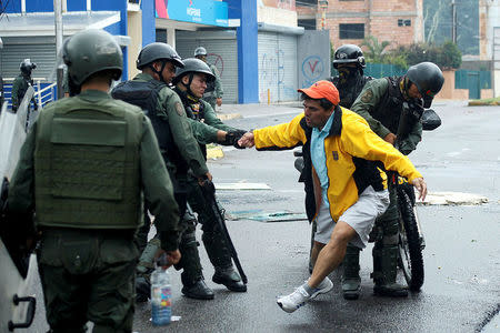 A demonstrator is detained by riot security forces during a protest against Venezuelan President Nicolas Maduro's government in San Cristobal, Venezuela May 29, 2017. REUTERS/Carlos Eduardo Ramirez