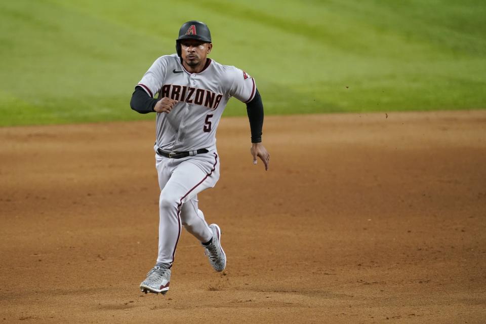 Arizona Diamondbacks' Eduardo Escobar sprints to third during a baseball game against the Texas Rangers in Arlington, Texas, Tuesday, July 27, 2021. (AP Photo/Tony Gutierrez)