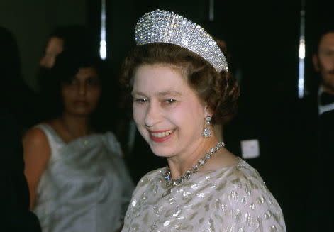 <p>This stunning <a href="https://web.archive.org/web/20160617164717/https://www.royalcollection.org.uk/exhibitions/diamonds-a-jubilee-celebration/queen-alexandras-kokoshnik-tiara" rel="nofollow noopener" target="_blank" data-ylk="slk:piece;elm:context_link;itc:0;sec:content-canvas" class="link ">piece</a> was a gift from the Ladies of Society on the wedding anniversary of King Edward VII and Queen Alexandra in 1888. It was eventually passed to Queen Elizabeth II, who can be seen wearing it here.</p>