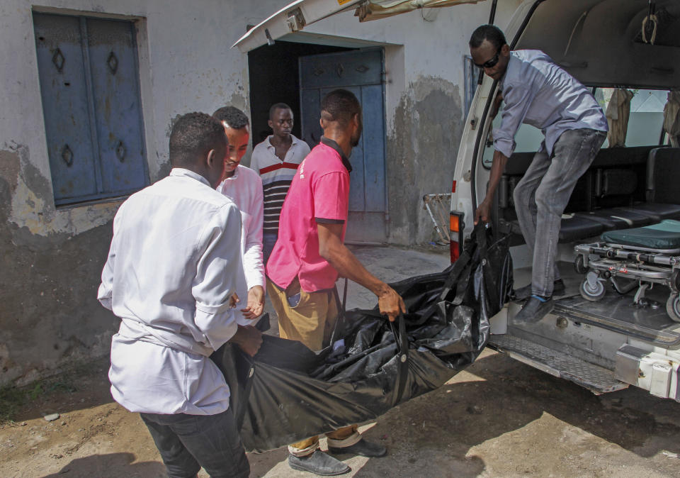 The body of one of the victims of a bomb attack is brought to the morgue at a hospital in the capital Mogadishu, Somalia, Saturday, June 15, 2019. (AP Photo/Farah Abdi Warsameh)