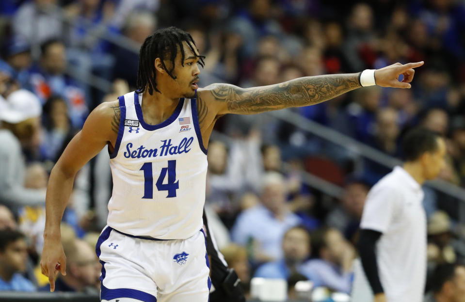 Seton Hall guard Dre Davis (14) reacts after making a 3-point basket against Marquette during the first half of an NCAA college basketball game in Newark, N.J., Saturday, Jan. 21, 2023. (AP Photo/Noah K. Murray)