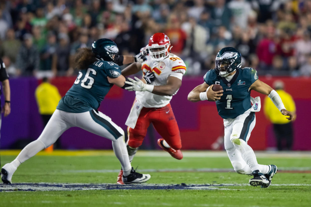 Feb 12, 2023; Glendale, Arizona, US; Philadelphia Eagles quarterback Jalen Hurts (1) runs the ball against the Kansas City Chiefs during Super Bowl LVII at State Farm Stadium. Mandatory Credit: Mark J. Rebilas-USA TODAY Sports