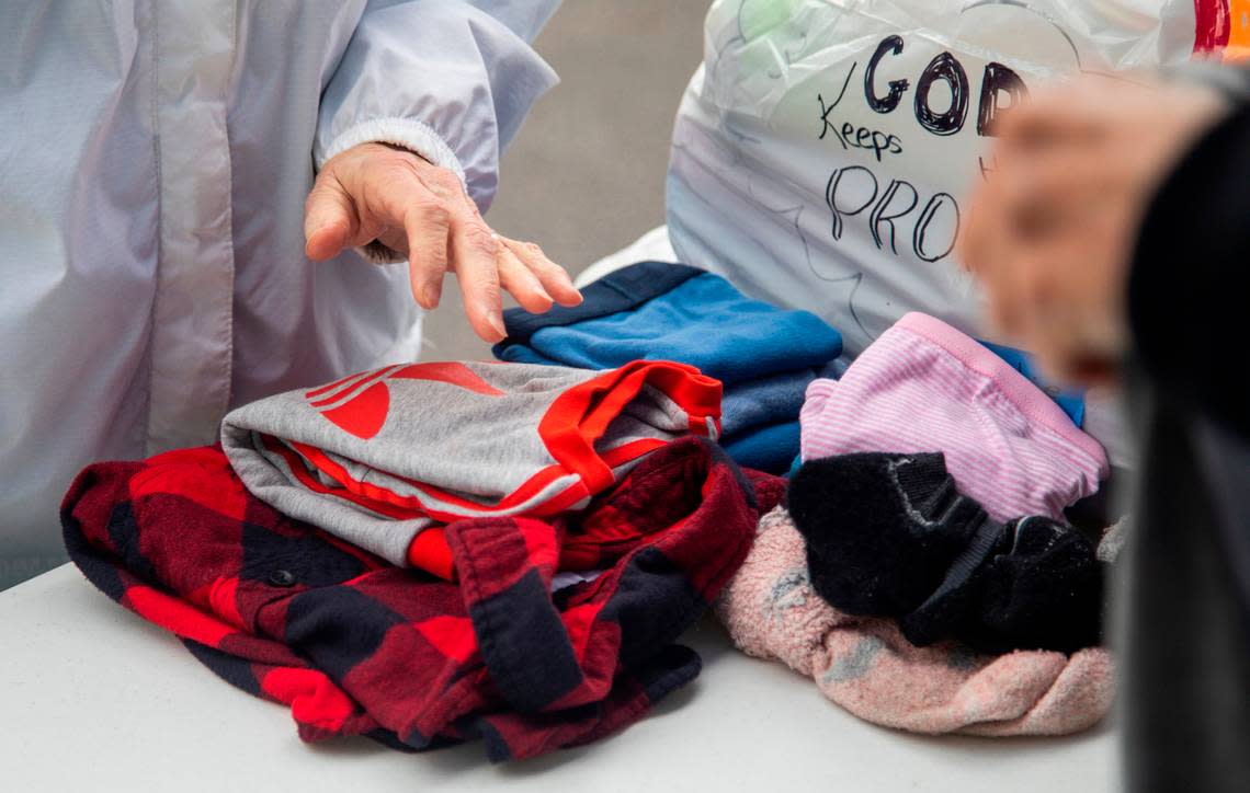 Volunteers with a N.C. Baptists on Mission disaster relief crew fold laundry for people effected by power outages in Moore County Tuesday, Dec. 6, 2022 at the First Baptist Church of Pinehurst . Two deliberate attacks on electrical substations in Moore County Saturday evening caused days-long power outages for tens of thousands of customers.