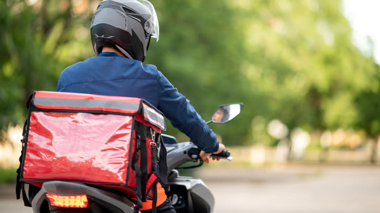 Food delivery driver on a scooter