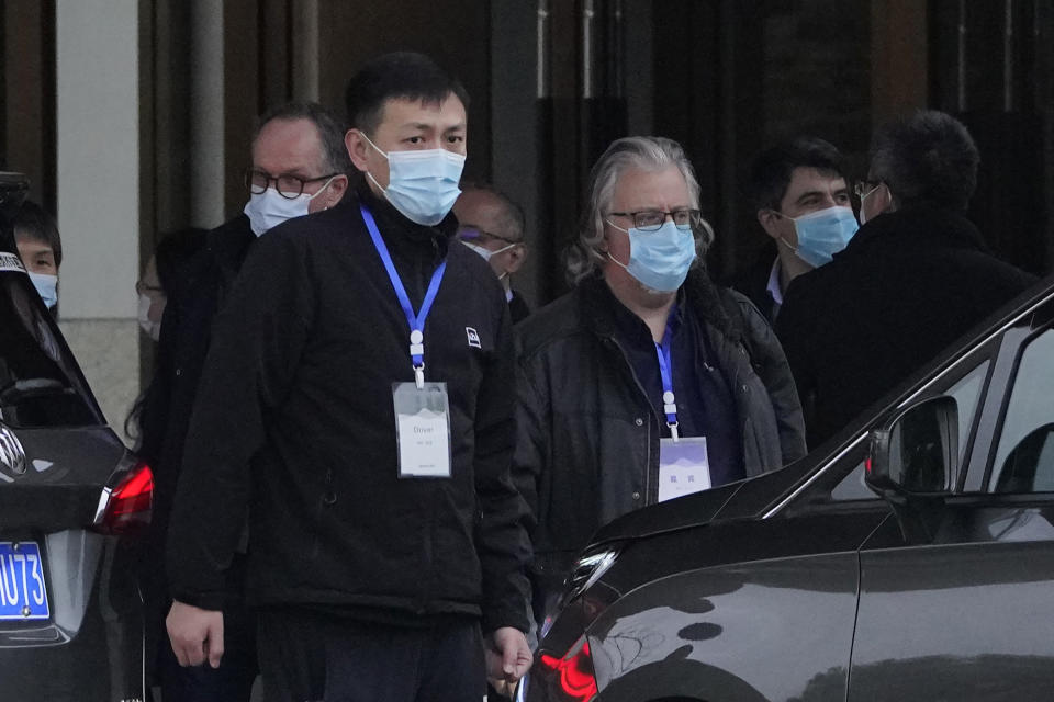 Members of the World Health Organization team prepare to leave for a second day of field visit in Wuhan in central China's Hubei province on Saturday, Jan. 30, 2021. (AP Photo/Ng Han Guan)