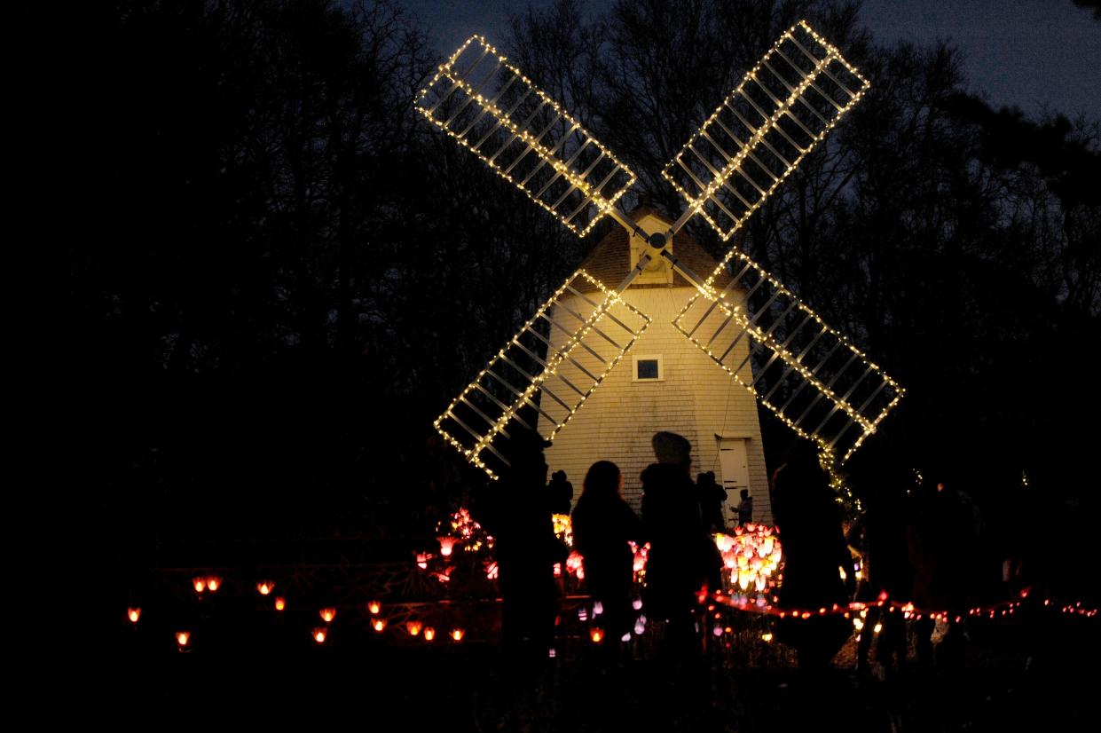 The Old East Mill lights up the McGraw Family Garden of the Senses at Heritage Museums & Gardens in Sandwich. The "Gardens Aglow" exhibit, featuring light displays, outdoor activities and a festive holiday atmosphere, draws thousands of visitors to Sandwich each year.