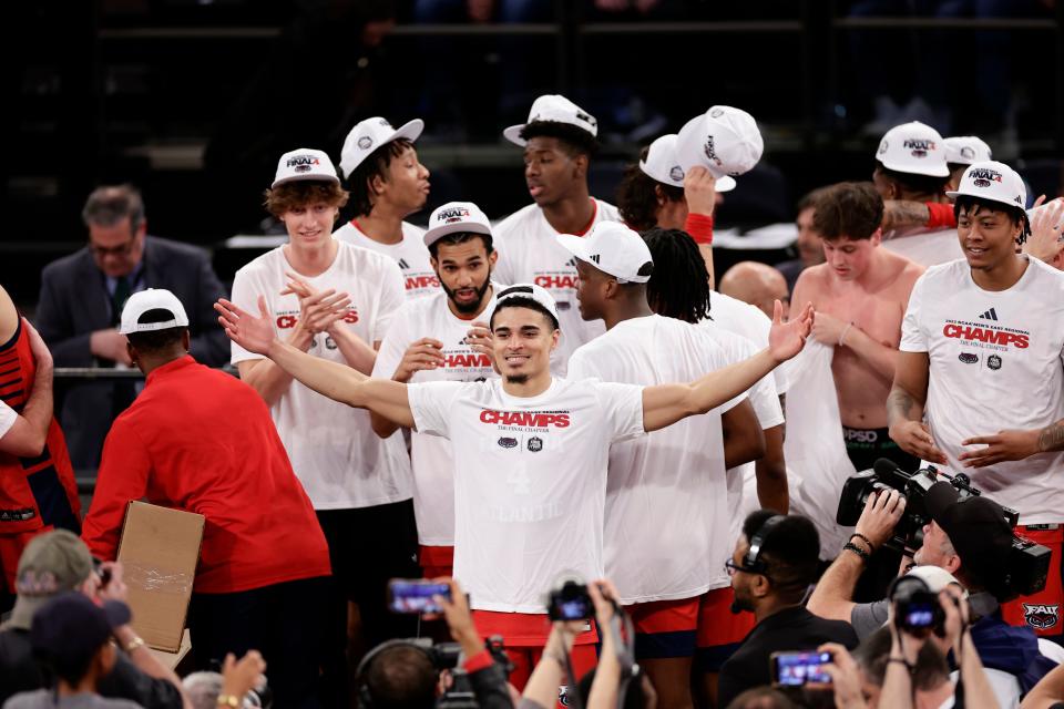 Florida Atlantic players celebrate after defeating Kansas State an Elite 8 college basketball game in the NCAA Tournament's East Region final, Saturday, March 25, 2023, in New York. (AP Photo/Adam Hunger)