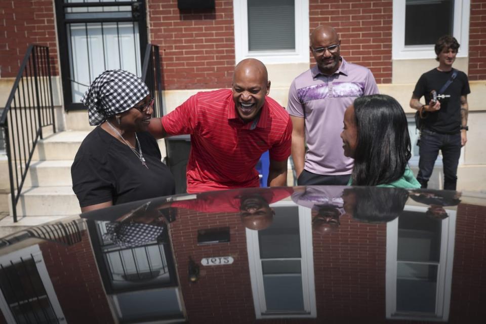 Maryland Democratic gubernatorial candidate Wes Moore talks with city residents after helping at a food distribution center at the Ruth Kirk Recreation Center September 16, 2022 in Baltimore, Maryland. Moore is running against Republican gubernatorial candidate Dan Cox. (Photo by Win McNamee/Getty Images)